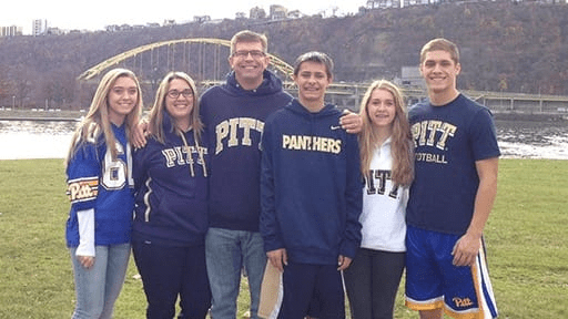 Dr. Barry Bartusiak and his children cheering on Pitt